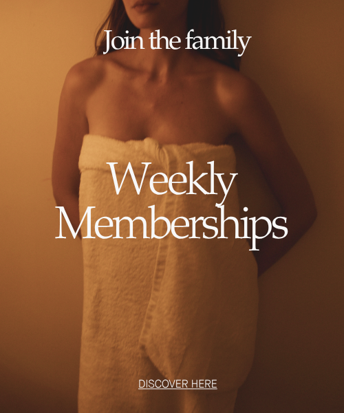 A warm-toned promotional photo showing a woman wrapped in a towel, with overlaid text reading 'Join the family', 'Weekly Memberships', and 'DISCOVER HERE'. This is not a clean product shot, chart, swatch, or instruction graphic, and there is no clearly sellable physical product isolated as the subject, so subject_type is Other.